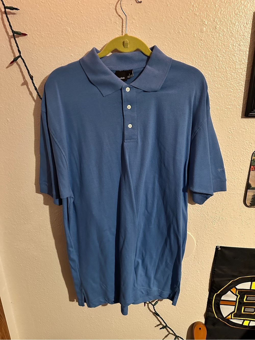 Reebok Men's Light Blue Polo Shirt with Three-Button Placket